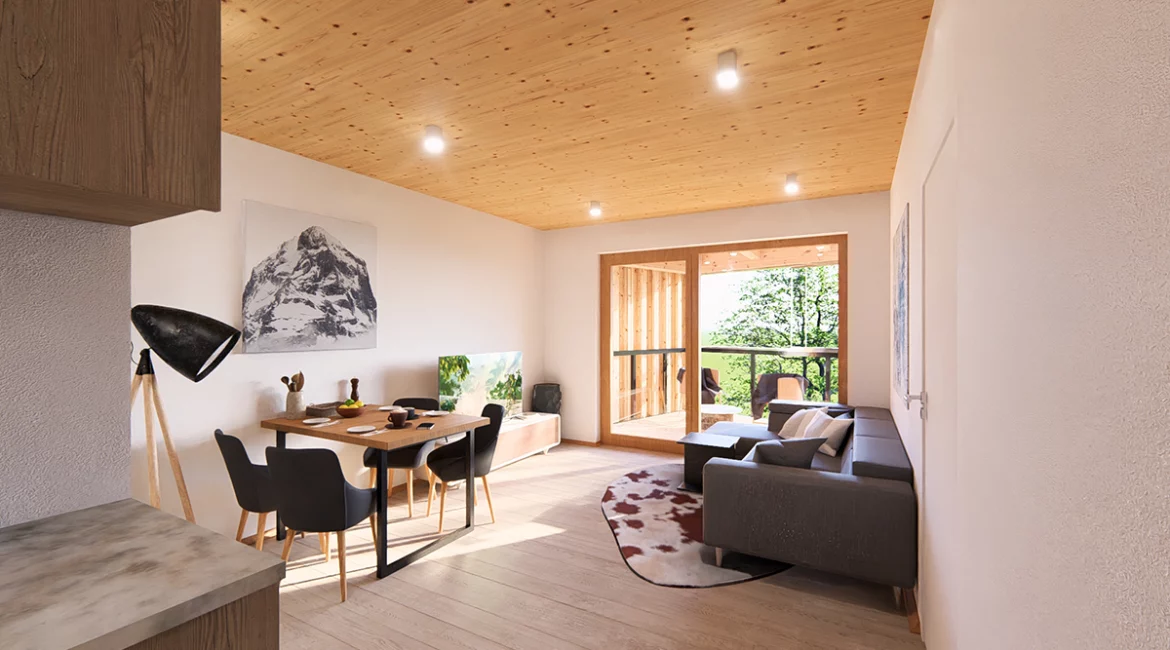 Innenansicht einer Wohnung im Projekt Piesendorf mit Holzsichtdecke und Sicht auf den Balkon